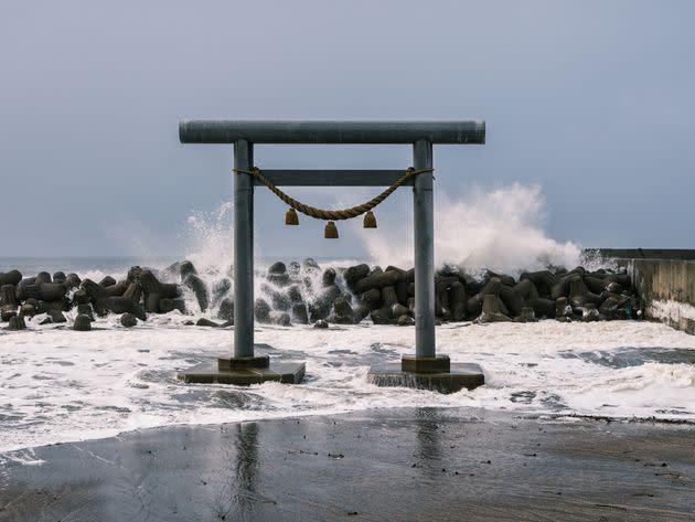 Shinto torii gate and tetrapods, Noto Peninsula, Japan.