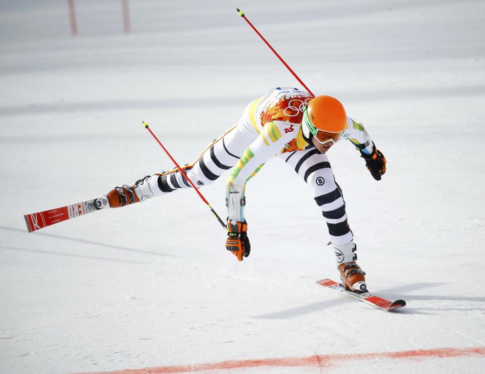 Germany's Stefan Luitz loses his balance after crashing into the last gate and gets disqualified, during the first run of the men's alpine skiing giant slalom event in the Sochi 2014 Winter Olympics at the Rosa Khutor Alpine Center February 19, 2014. REUTERS/Kai Pfaffenbach (RUSSIA - Tags: OLYMPICS SPORT SKIING)