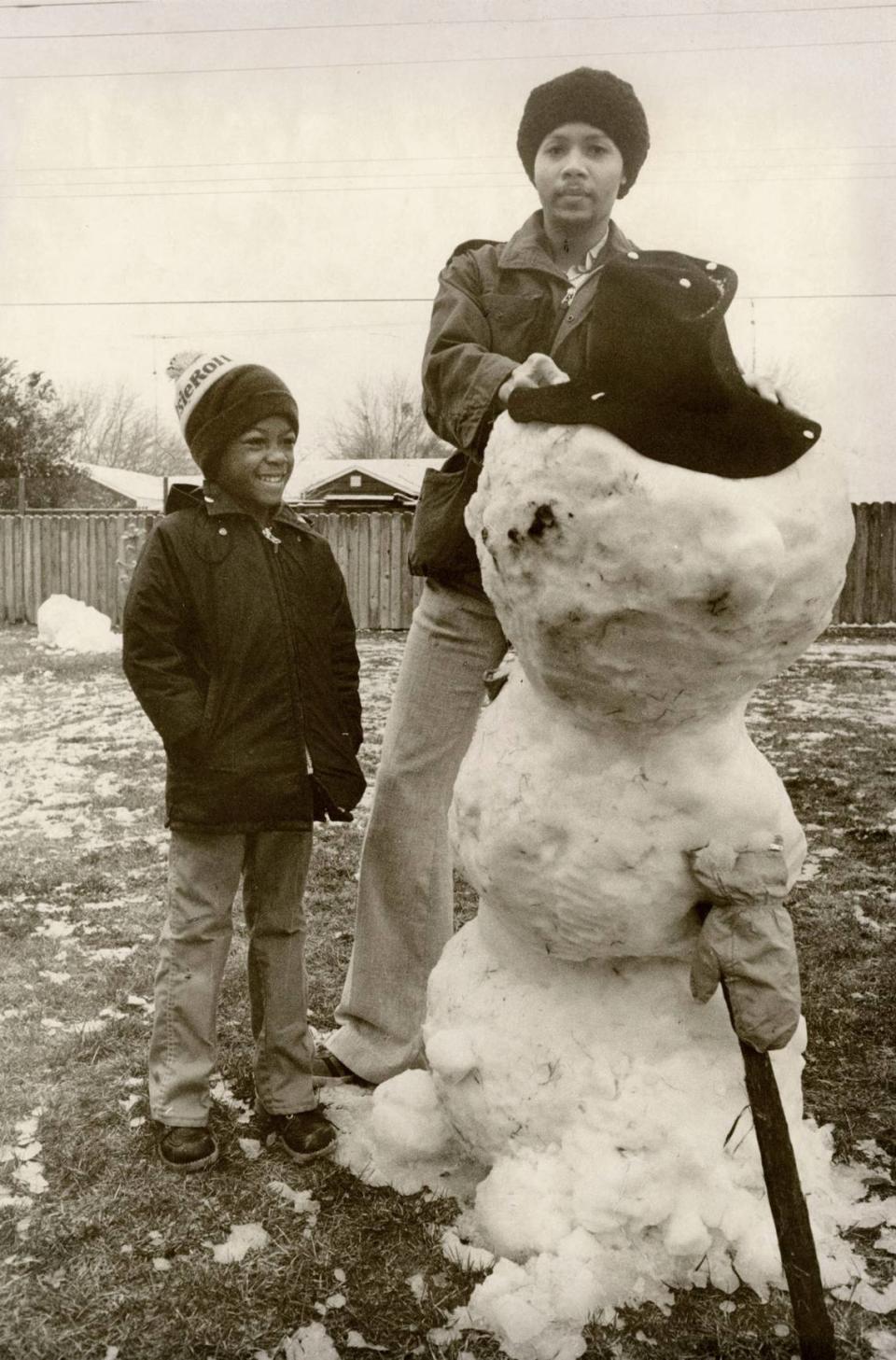 Stan Livermon and Charles Brown put the finishing touches on their snowman, February 5, 1976 Erhardt Krause/Sacramento Bee file