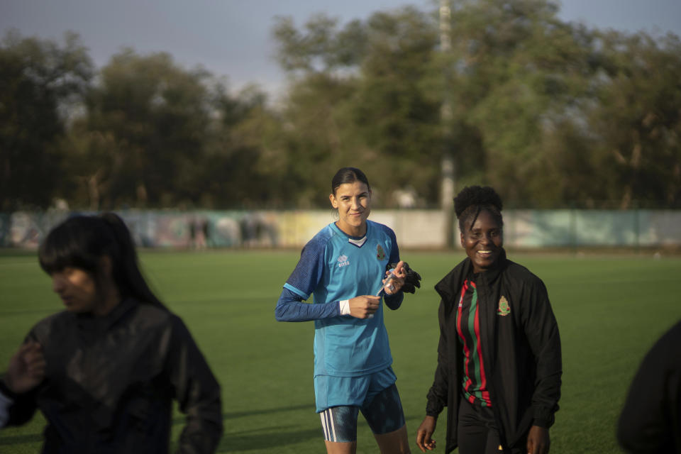 Khadija Er-Rmichi, Morocco's women national team's goalkeeper, smiles after winning the women's soccer league title for her team ASFAR, in Rabat, Morocco, Sunday, May 21, 2023. (AP Photo/Mosa'ab Elshamy)