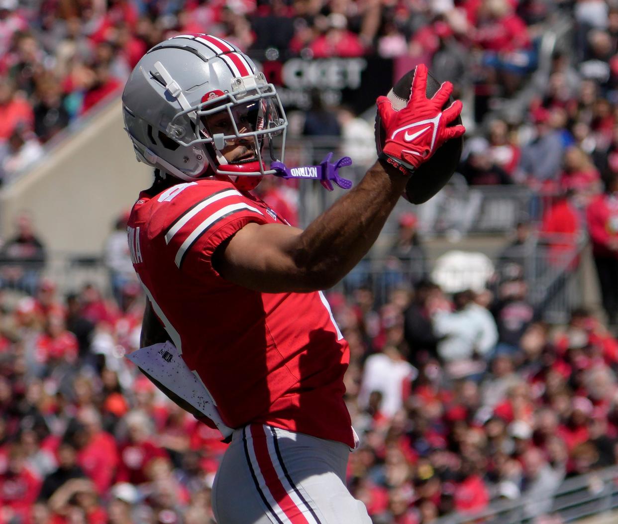 April 13, 2024; Columbus, Ohio, USA; 
Ohio State Buckeyes wide receiver Emeka Egbuka (2) catches a pass for the scarlet team during the first half of the LifeSports Spring Game at Ohio Stadium on Saturday.