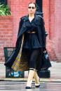 <p>Irina Shayk sports a trench coat and boots on a rainy Wednesday in N.Y.C.</p>