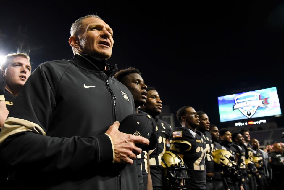 Army head coach Jeff Monken sings the alma mater song following the conclusion of the Armed Forces Bowl NCAA college football game in Fort Worth, Texas, Wednesday, Dec. 22, 2021. Army won the game by a final of 24-22. (AP Photo/Emil Lippe)