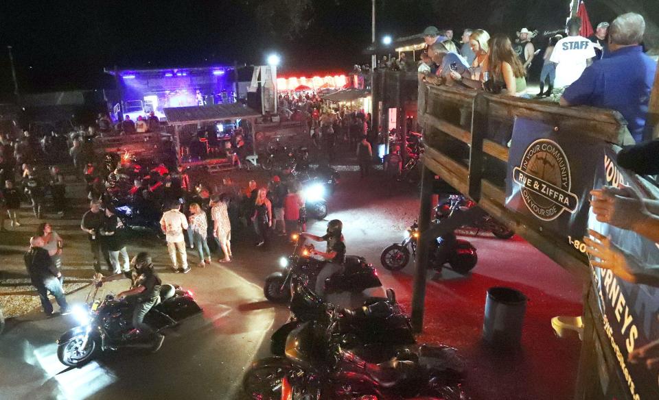 In this March 5, 2022, file photo, bikers gather at the Iron Horse Saloon, one of many spots for nighttime Bike Week action.