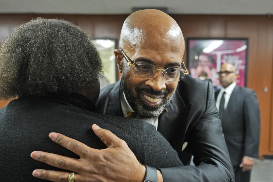 The Rev. Frederick D. Haynes III gets a hug in Dallas, Thursday, Feb. 1, 2024. The civil rights group founded by the Rev. Jesse Jackson in the 1970s is elevating a new leader for the first time in more than 50 years, choosing Haynes as his successor to take over the Rainbow PUSH Coalition. (AP Photo/LM Otero)