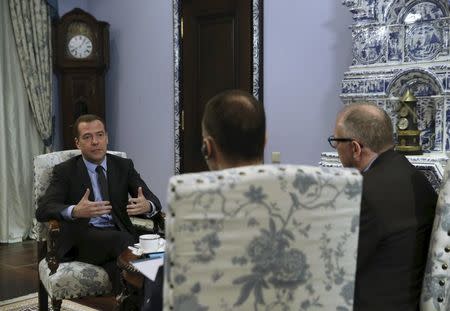 Russian Prime Minister Dmitry Medvedev (L) speaks during an interview at the Gorki state residence outside Moscow, Russia, February 11, 2016. REUTERS/Ekaterina Shtukina/Sputnik/Pool