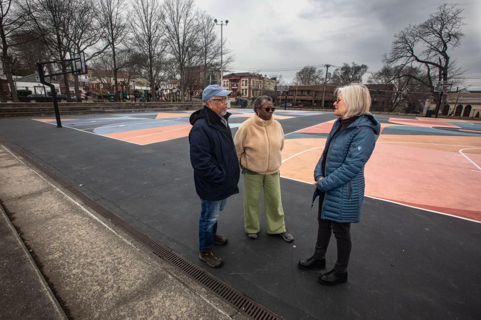 Stuart Reid, President of the Lincoln Park Conservancy, his wife Linda Tarrant-Reid, Executive Director of the Conservancy, and Anne Zahner, an activist and thirty-five year resident of New Rochelle, stand on the basketball court at Lincoln Park in New Rochelle Feb. 22, 2023. The basketball court sits on the footprint of what was the Lincoln Elementary School, which at the time it was razed in 1963, served the Black population of the city and was the center of a court fight to desegregate New Rochelle schools.