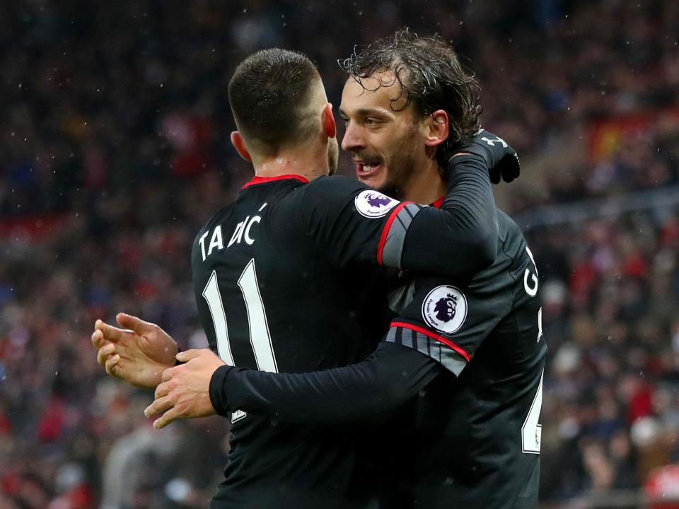 Manolo Gabbiadini celebrates with Dusan Tadic after bagging his second (Getty)