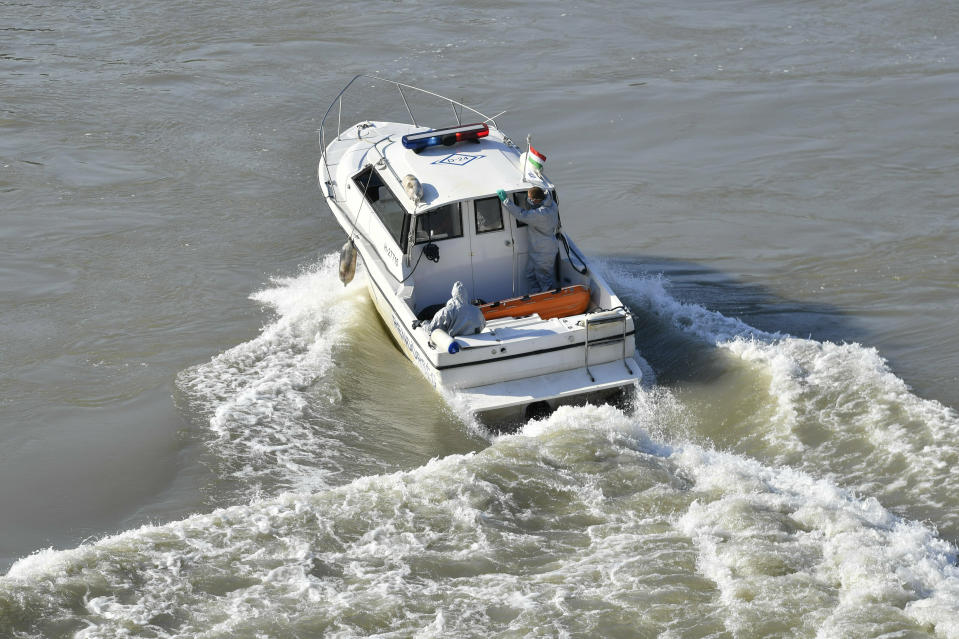 A body found in the sunk shipwreck of the Hableany is transported to land Tuesday, June 11, 2019 during the recovery operation at Margaret Bridge, the scene of the fatal boat accident in Budapest, Hungary. (Zoltan Mathe/MTI via AP)