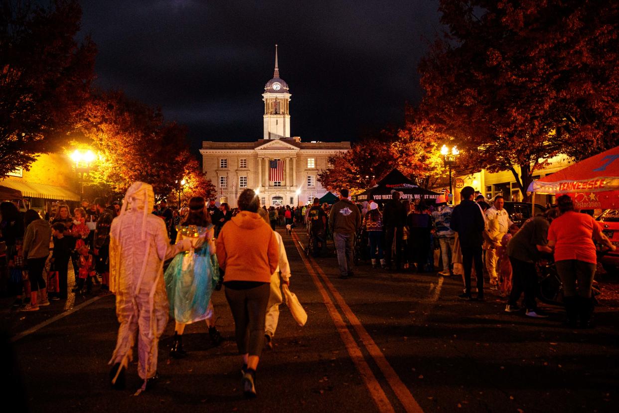 Trick or treaters line up around the courthouse during Haunting in the District in Columbia, Tenn. on Oct. 31, 2022. 