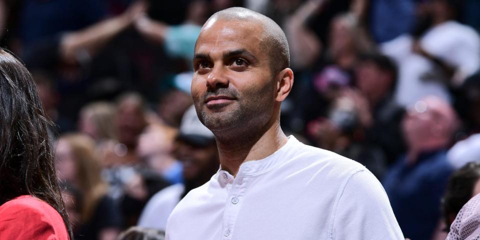 Tony Parker looks on from the stands of an NBA game in 2022.