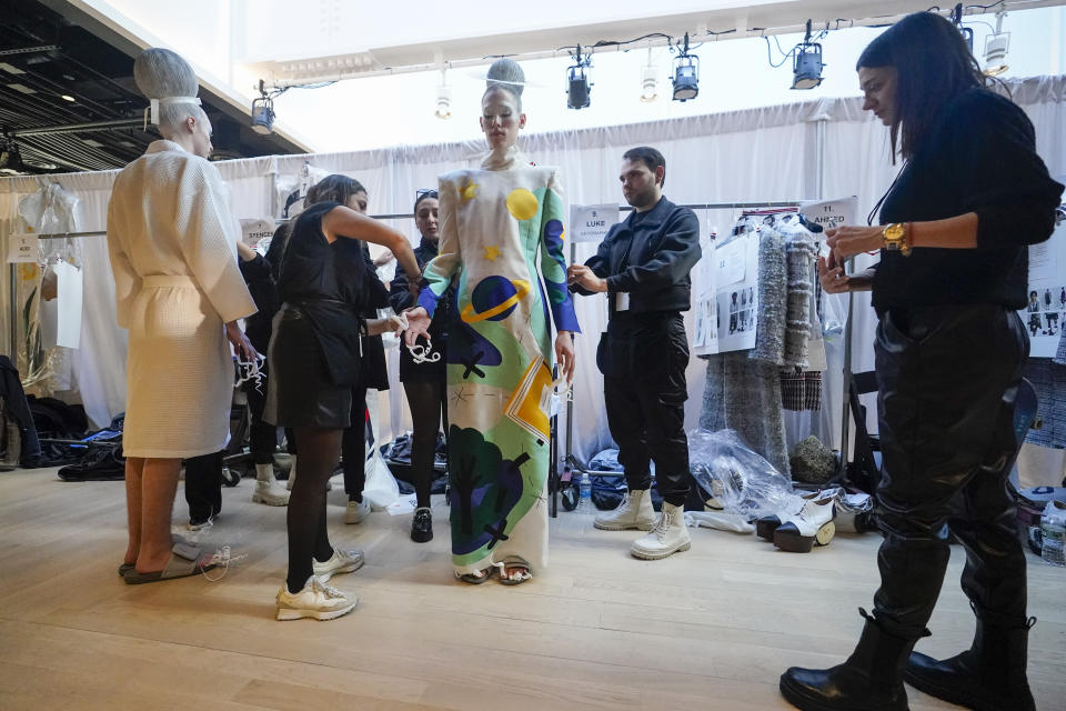 A model is dressed backstage ahead of the Thom Browne collection presentation during Fashion Week, Tuesday, Feb. 14, 2023, in New York. (AP Photo/Mary Altaffer)