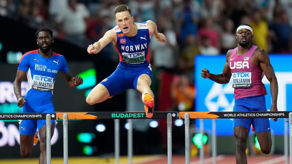 Warholm clears the final hurdle ahead of Kyron Mcmaster of the British Virgin Islands and Rai Benjamin of the United States to win the gold medal. - Petr David Josek/AP