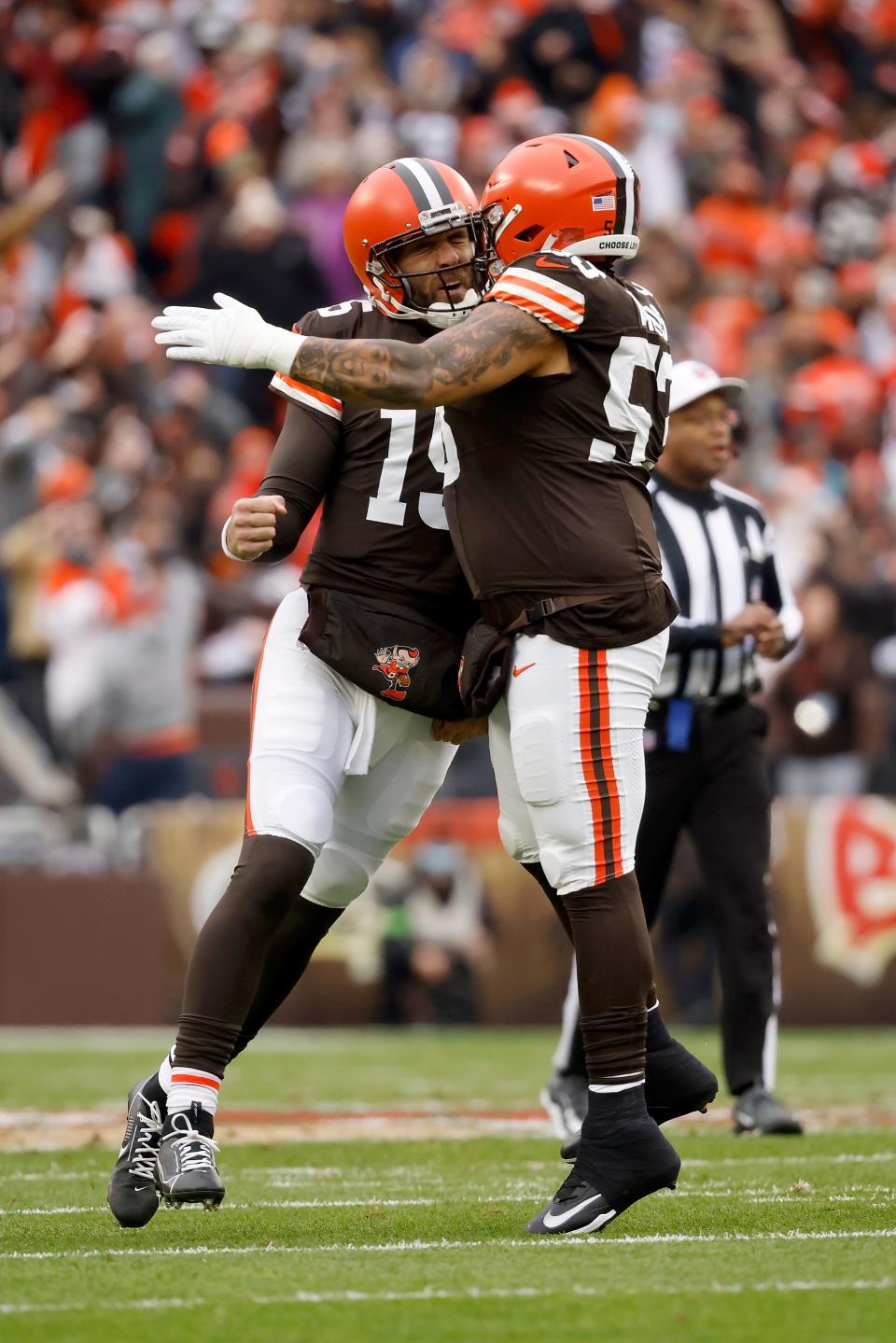 Browns quarterback Joe Flacco (15) celebrates with center Nick Harris after throwing a touchdown pass against Jacksonville, Sunday, Dec. 10, 2023, in Cleveland.