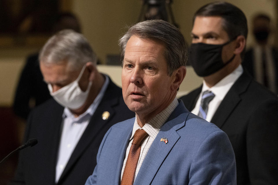 Georgia Gov. Brian Kemp, center, Speaker of the House David Ralston and Lt. Gov. Geoff Duncan hold a press conference Wednesday evening, Jan. 6, 2021, at the Georgia State Capitol in Atlanta, to condemn the breach of the U.S. Capitol. (AP Photo/Ben Gray)