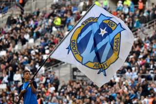 Olympique Marseille's flag with the logo is waved prior to the French L1 football match between Olympique de Marseille (OM) and Football Club de Nantes (FCN) at the Velodrome Stadium in Marseille, southern France, on February 22, 2020. - Nantes won 3-1. (Photo by GERARD JULIEN / AFP)