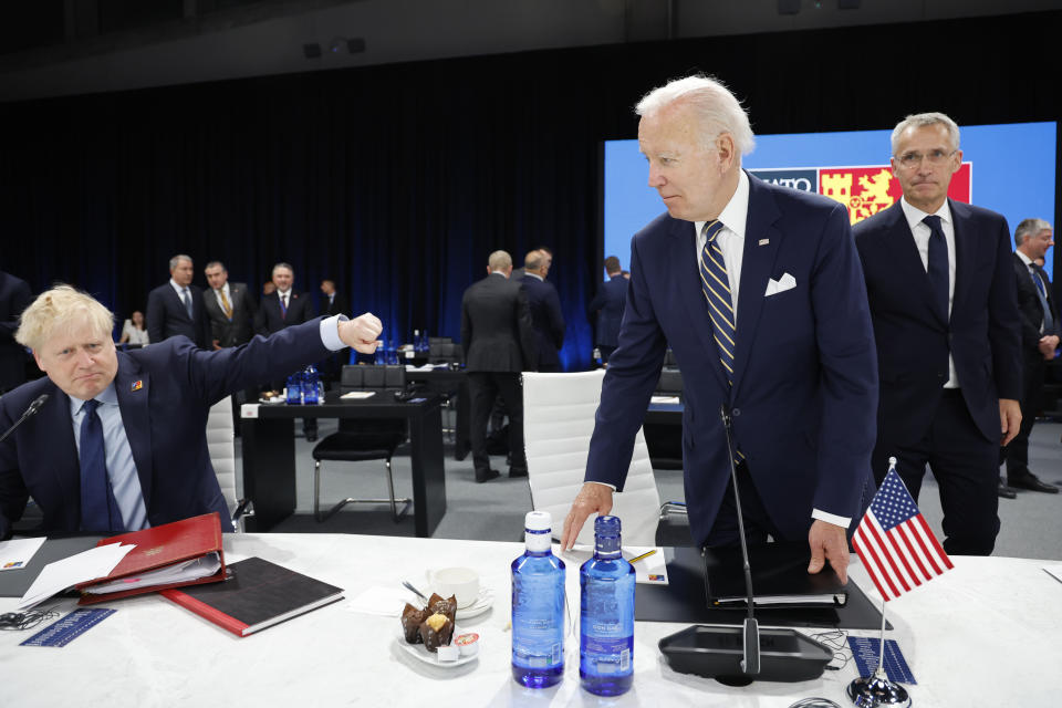 British Prime Minister Boris Johnson, left, gestures next to U.S. President Joe Biden and NATO Secretary General Jens Stoltenberg, right, during the Meeting of the North Atlantic Council Session with fellow heads of state at the NATO summit at the IFEMA arena in Madrid, Thursday, June 30, 2022. (Jonathan Ernst/Pool Photo via AP)