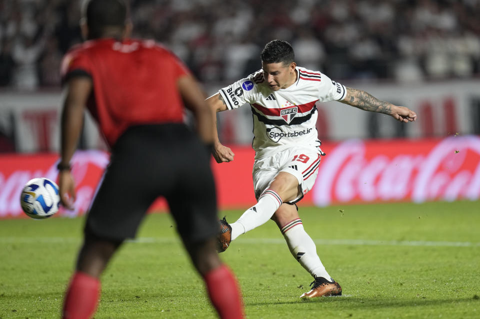 James Rodriguez of Brazil's Sao Paulo takes his shot, and misses during the penalty shootout of a Copa Sudamericana quarterfinal, second leg soccer match against Ecuador's Liga Deportiva Universitaria at Morumbi stadium in Sao Paulo, Brazil, Thursday, Aug. 31, 2023. Ecuador's Liga Deportiva Universitaria won the shootout due to James´ miss and advanced to the semifinals of the tournament. (AP Photo/Andre Penner)