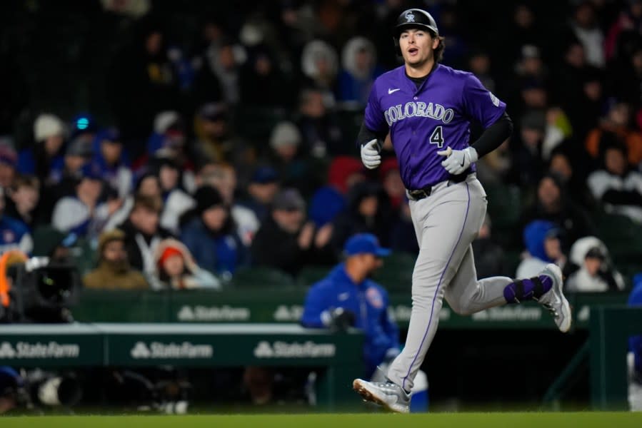 Colorado Rockies' Michael Toglia runs the bases after hitting a two-run home run during the seventh inning of a baseball game against the Chicago Cubs, Tuesday, April 2, 2024, in Chicago. (AP Photo/Erin Hooley)
