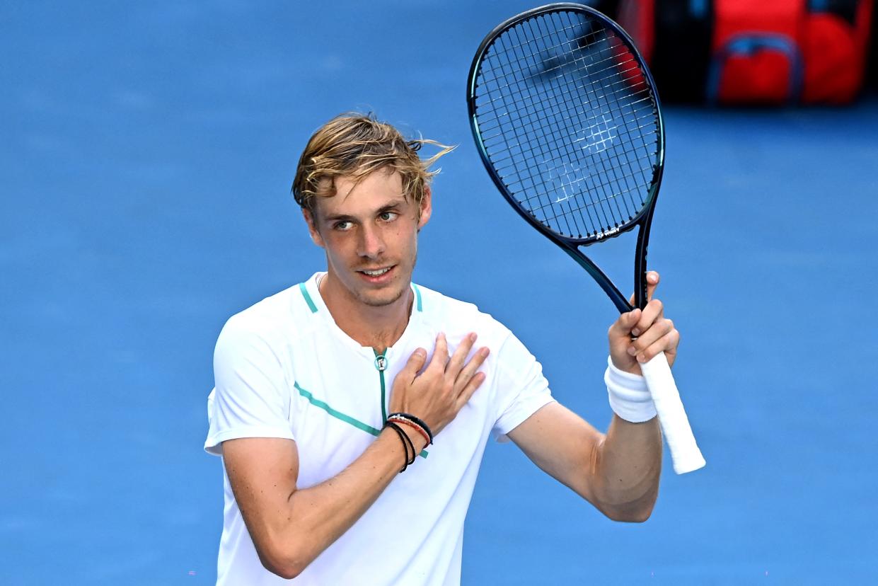 Canada's Denis Shapovalov celebrates victory against Germany's Alexander Zverev during their men's singles match on day seven of the Australian Open tennis tournament in Melbourne on January 23, 2022. - -- IMAGE RESTRICTED TO EDITORIAL USE - STRICTLY NO COMMERCIAL USE -- (Photo by MICHAEL ERREY / AFP) / -- IMAGE RESTRICTED TO EDITORIAL USE - STRICTLY NO COMMERCIAL USE -- (Photo by MICHAEL ERREY/AFP via Getty Images)