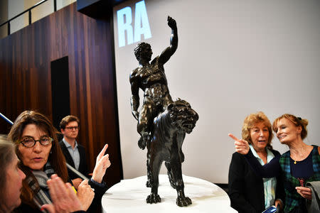 Art lovers take a close-up look at 'Rothschild Bronzes', confirmed as the only surviving bronze sculpture by Michelangelo, during an event at The Royal Academy of Arts (RA) in London, Britain, November 14, 2018. REUTERS/Dylan Martinez