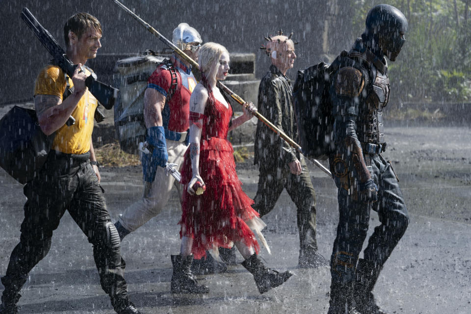 This image provided by Warner Bros. Pictures shows Joel Kinnaman, from left, John Cena, Margot Robbie, Peter Capaldi and Idris Elba in a scene from "The Suicide Squad." (Jessica Miglio/Warner Bros. Pictures via AP)