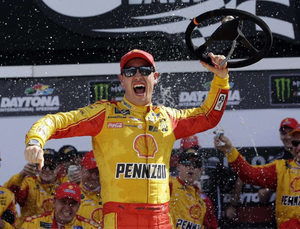 Joey Logano celebrates in Victory Lane after winning the NASCAR Clash auto race at Daytona International Speedway, Sunday, Feb. 19, 2017, in Daytona Beach, Fla. (AP Photo/John Raoux)