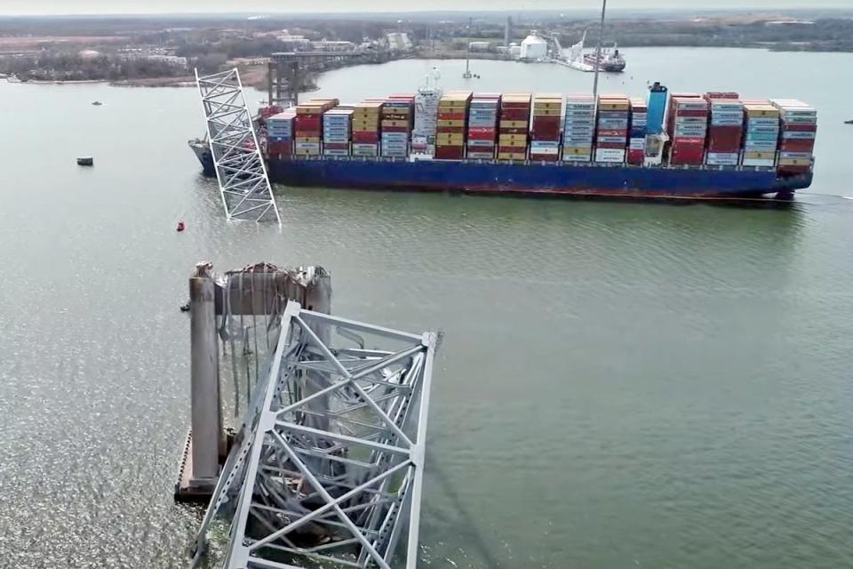 The collapsed bridge is seen in an aerial image (AP)