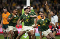 South Africa's Damian de Allende, center, celebrates scoring a try against Australia during their Championship Rugby test match in Sydney, Saturday, Sept. 3, 2022. (AP Photo/Rick Rycroft)