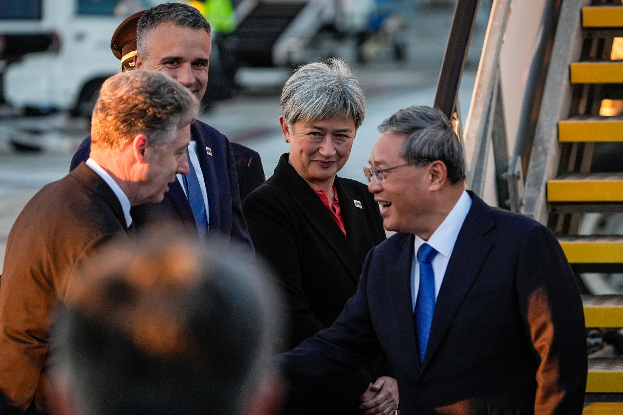 China's Premier Li Qiang (R) greets Australia's Foreign Minister Penny Wong, South Australia's Premier Peter Malinauskas and other officials at Adelaide Airport. Source: AAP