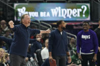 Milwaukee Bucks head coach Mike Budenholzer, left, gestures to an official during the first half of an NBA basketball game against the Boston Celtics, Thursday, March 30, 2023, in Milwaukee. (AP Photo/Aaron Gash)