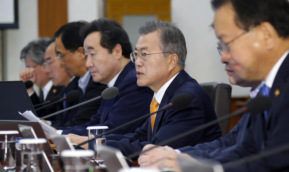 South Korean President Moon Jae-in, second from right, speaks during a cabinet meeting at the presidential Blue House in Seoul, South Korea, Tuesday, Oct. 23, 2018. The government of Moon formally approved the rapprochement deals he made with North Korean leader Kim Jong Un last month. (Bee Jae-man/Yonhap via AP)