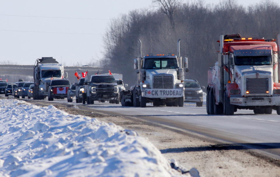 <p>Truckers arrive in a convoy to protest coronavirus disease (COVID-19) vaccine mandates for cross-border truck drivers, in Ottawa, Ontario, Canada, January 28, 2022. REUTERS/Patrick Doyle</p> 