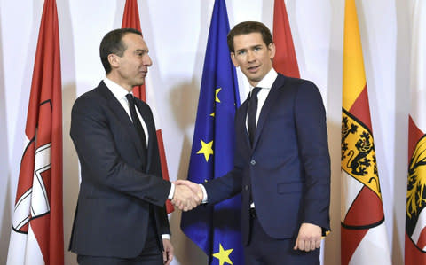 Outgoing Austrian chancellor Christian Kern, left, and new appointed Austrian Chancellor of the conservative People's Party Sebastian Kurz - Credit: HANS PUNZ/AFP