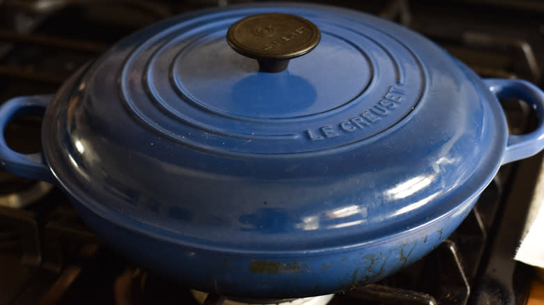 blue le creuset pot on stove