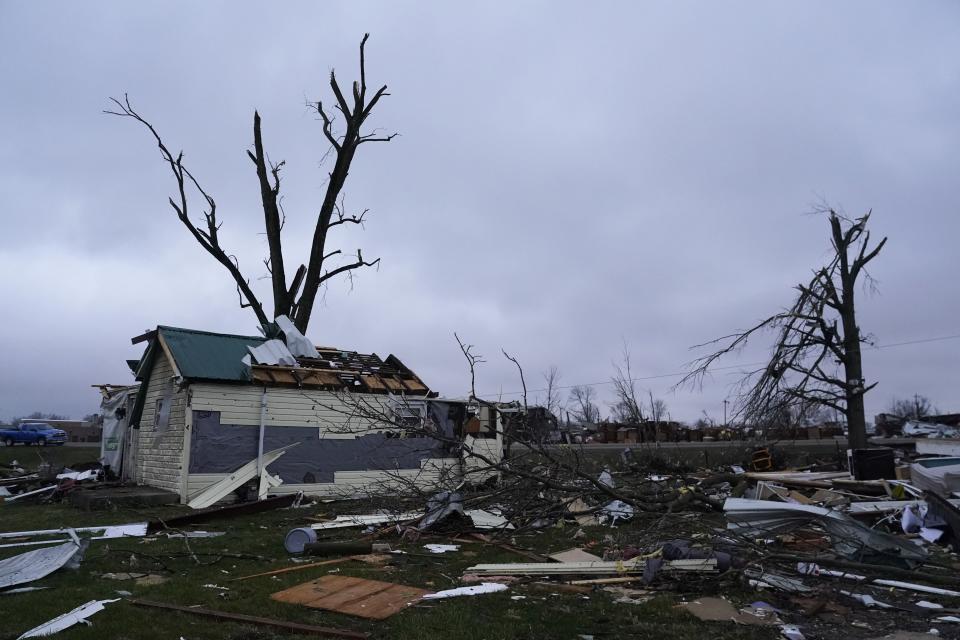 Debris is visible following a severe storm Friday, March 15, 2024, in Lakeview, Ohio. (AP Photo/Joshua A. Bickel)