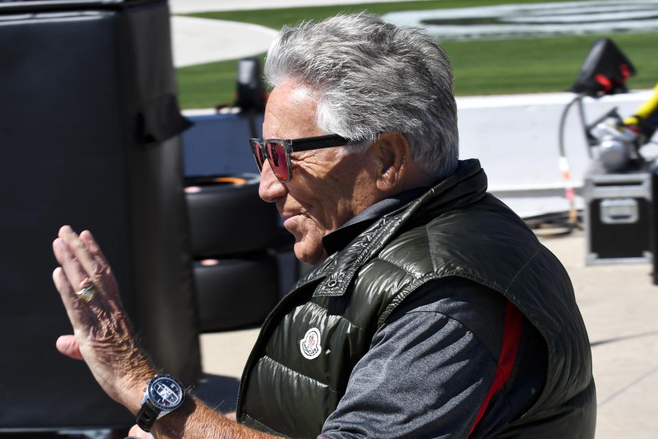 Mario Andretti waves to fans during a qualifying round for an IndyCar Series auto race at Texas Motor Speedway in Fort Worth, Texas, Saturday, March 19, 2022. (AP Photo/Larry Papke)