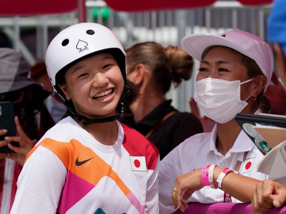 Japan's Momiji Nishiya smiles after winning gold at Tokyo 2020.