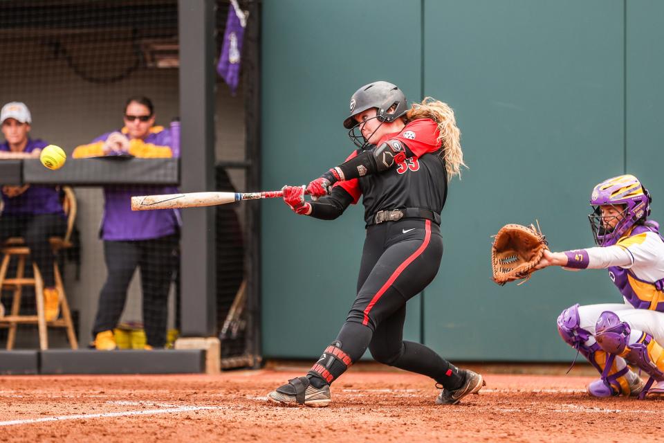 Georgia infielder Sara Mosley (33) swings as LSU catcher Cait Calland prepares to receive the ball during a game at Jack Turner Softball Stadium in Athens, Georgia, on Saturday, Apr. 23, 2022.