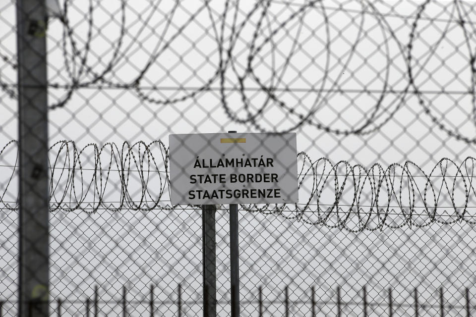 In this photo taken Monday, April 8, 2019, a sign reading: "State Border" is attached to a fence at Hungary's border with Serbia near the village Asotthalom, Hungary. With a campaign centered on stopping immigration, Hungary’s ruling Fidesz party is expected to continue its dominance in the European Parliament election at the end of May. While Hungary has been practically closed to immigrants from the Middle East, Asia and Africa since Prime Minister Viktor Orban had border fences built in 2015, he continues to warn voters about the threat of a “migrant invasion” that would put at risk Europe’s Christian culture. (AP Photo/Darko Vojinovic)