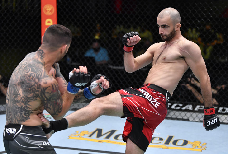 LAS VEGAS, NEVADA - MAY 01: (R-L) Giga Chikadze of Georgia kicks Cub Swanson in a featherweight bout during the UFC Fight Night event at UFC APEX on May 01, 2021 in Las Vegas, Nevada. (Photo by Jeff Bottari/Zuffa LLC)
