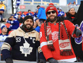 <p>A Leafs fan and a Wings fan in the stands. (Getty) </p>