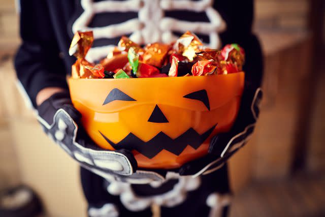 <p>Getty</p> Stock photo of a child with Halloween candy