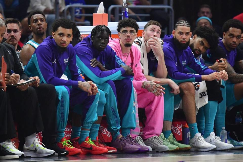 Charlotte Hornets guard LaMelo Ball (1) watches game action from the bench against the Los Angeles Clippers during the first half at Crypto.com Arena.
