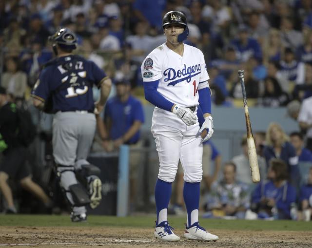 Dodgers strike against Phillies bullpen after rain delay halts