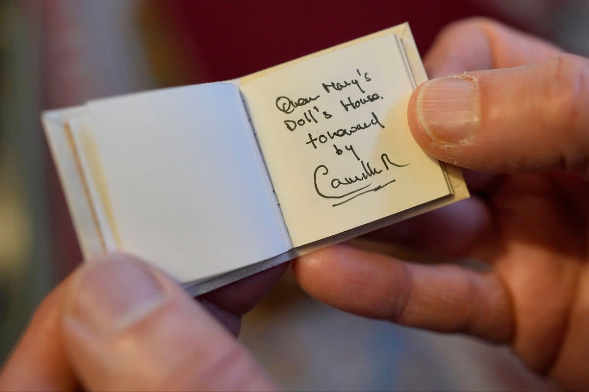 A miniature book written by Queen Camilla shown during a reception at Windsor Castle (PA)