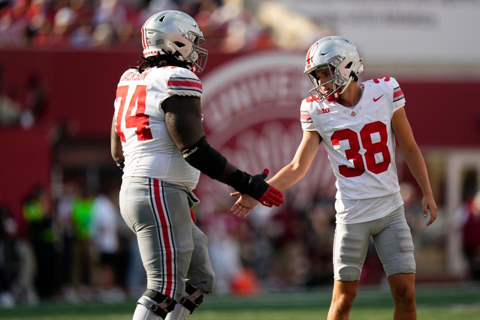 Ohio State's Jayden Fielding, right, took kickoffs for the Buckeyes last year and this season added field goal kicking to his duties.