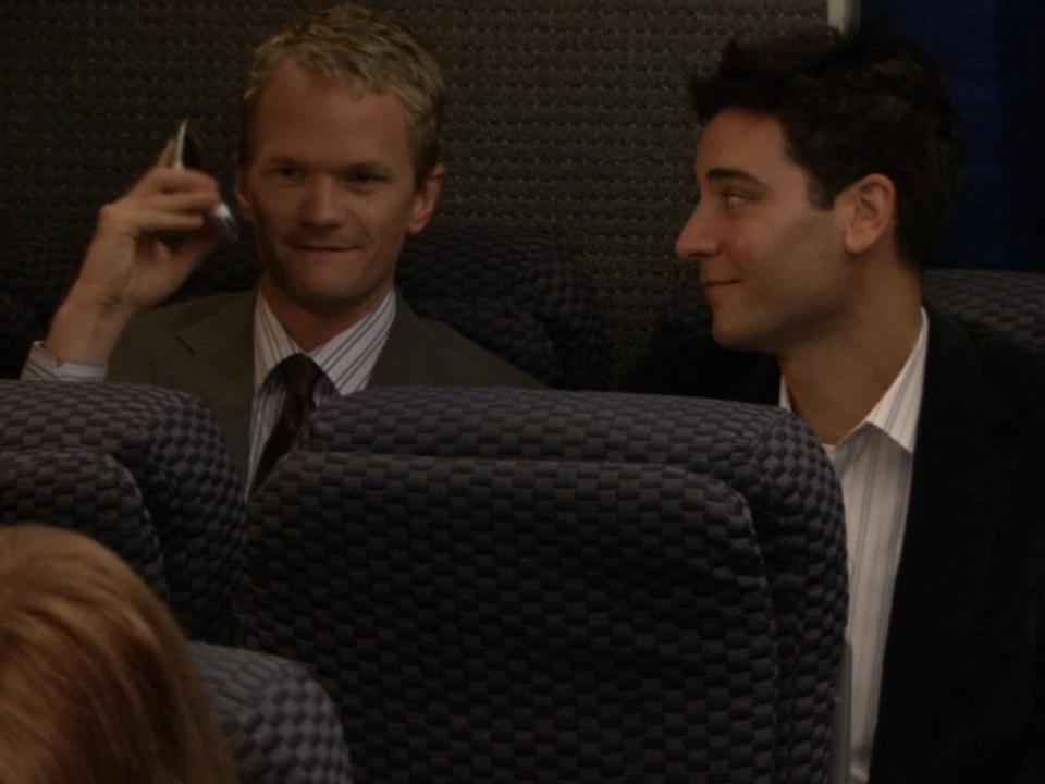 barney closing his flip phone while sitting next to ted on an airplane on how i met your mother