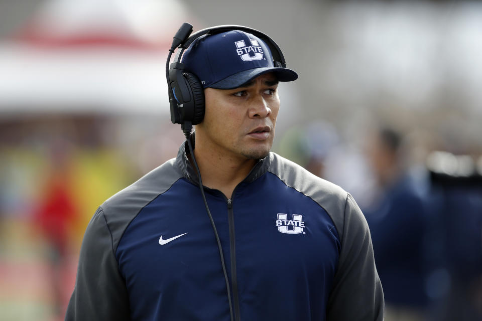 Utah State interim head coach Frank Maile walks the sidelines during the first half of the New Mexico Bowl NCAA college football game against North Texas in Albuquerque, N.M., Saturday, Dec. 15, 2018. (AP Photo/Andres Leighton)