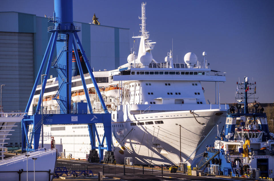 The former cruise ship "Superstar Libra" is moored at the outfitting quay of MV Werft shipyard in Wismar, Germany, Thursday, Jan. 6, 2022. The German government called on Malaysia-based Genting Group to contribute financially to the rescue of a shipyard it bought five years ago in northern Germany. German news agency dpa reported that the shipyard, MV Werften, filed for bankruptcy protection Monday, putting some 1,900 jobs at risk. (Jens Buettner/dpa via AP)